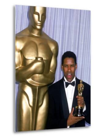'Actor Denzel Washington Holding His Oscar in Press Room at Academy