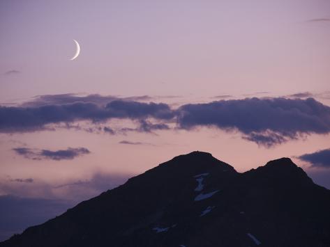 A Crescent Moon Rises Over Cloudountains At Twilight In A Crescent Moon Rises Over Cloudountains At Twilight In Glacier Peak Wilderness Washington