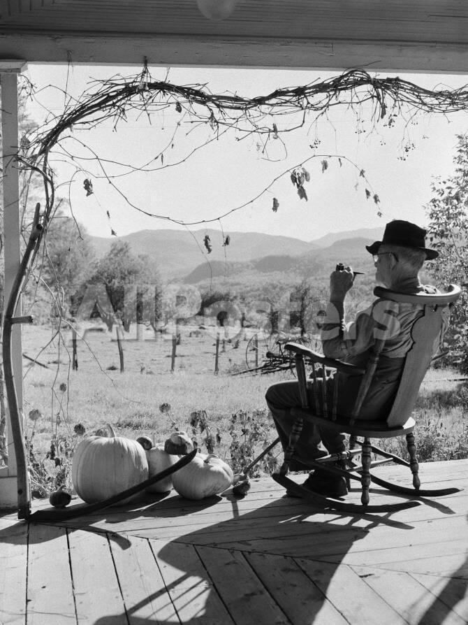 h-armstrong-roberts-elderly-farmer-smoking-pipe-sitting-on-rocker-on-front-porch-looking-out-onto-land_a-G-7994891-14258388.jpg