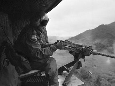 'Vietnam War US Helicopter Gunner' Photographic Print - Henri Huet