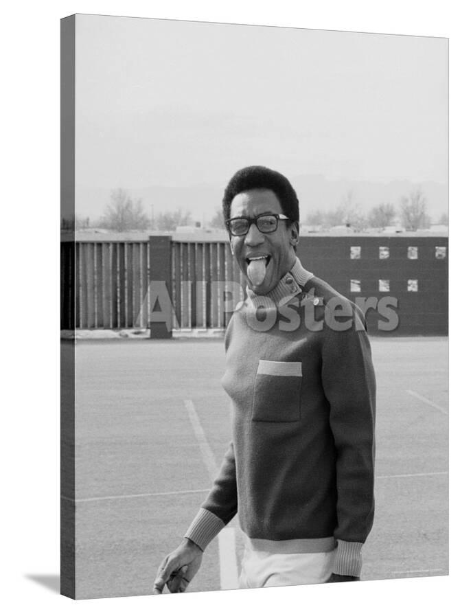 Comedian Bill Cosby Sticking His Tongue Out During Game Of