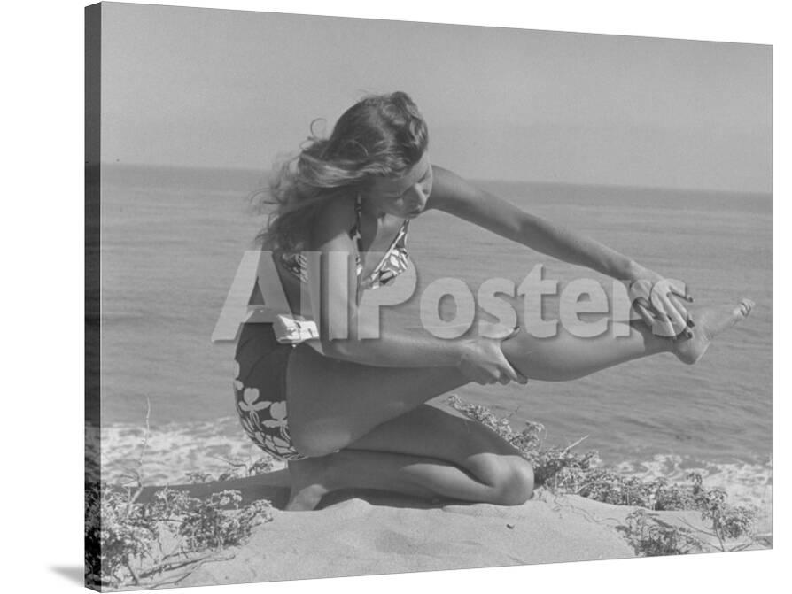 Woman Applying Suntan Lotion At The Beach Photographic Print Peter Stackpole Allposters Com