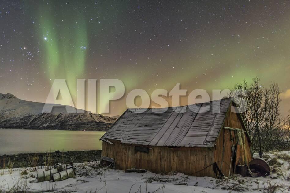 The Northern Lights Illuminates The Wooden Cabin Svensby Lyngen
