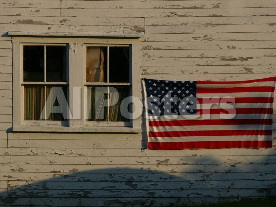 Evening Light On An American Flag On The Side Of An Old Barn