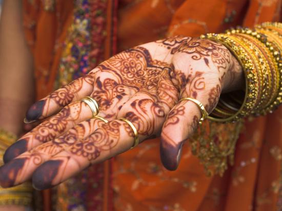 'Wedding Guest Showing Henna Marking on Her Hand, Dubai, United Arab