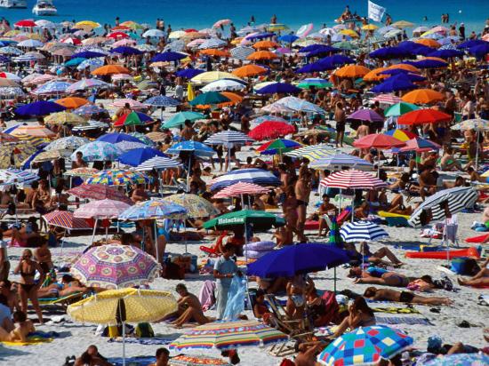 Many Umbrellas At Spiaggia Di Pelosa Stintino Sardinia Italy