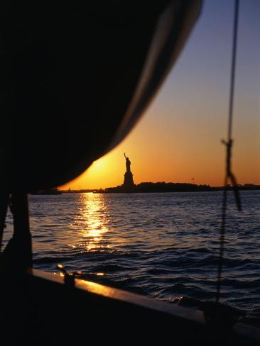 Statue Of Liberty At Sunset From Staten Island Ferry New York