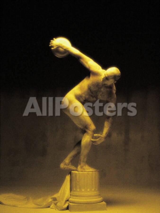 Nude Man Painted Gold Posing As A Statue
