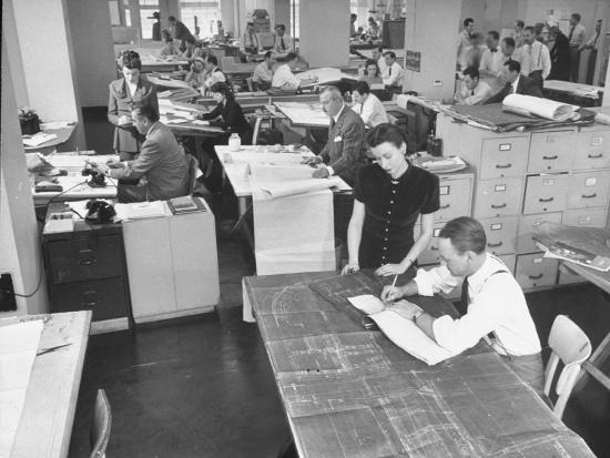 People Working In A Drafting Room