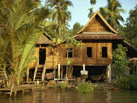 Traditional Thai House on Stilts Above the River in Bangkok, Thailand
