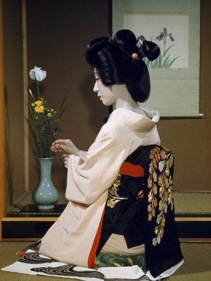 'Portrait of a Seated Geisha Wearing Kimono and Obi 