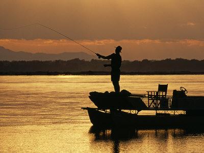 'Lower Zambezi National Park, Fly Fishing for Tiger Fish from a Barge on the Zambezi River at