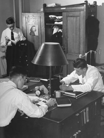 A View Of Cadets At The Annapolis Naval Academy Studying In Their Dorm Room
