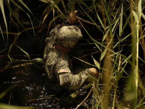 A Us Army Soldier Searches For Three Missing Soldiers In Yusifiyah Iraq May 15 2007