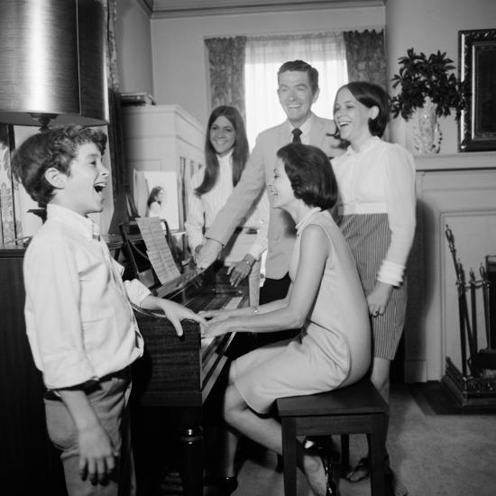 Image result for family around the piano