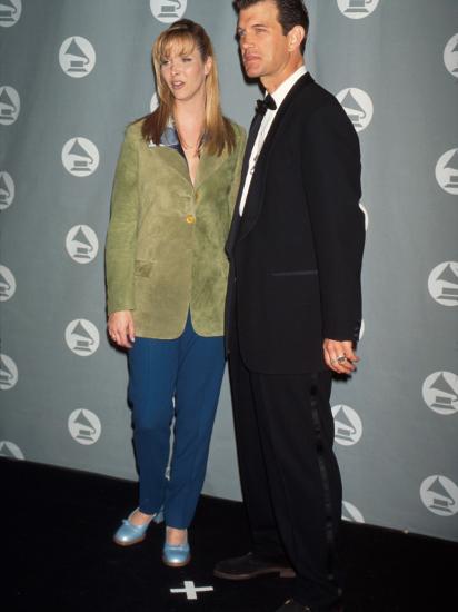 Actress Lisa Kudrow And Singer Chris Isaak In Press Room At Grammy Awards