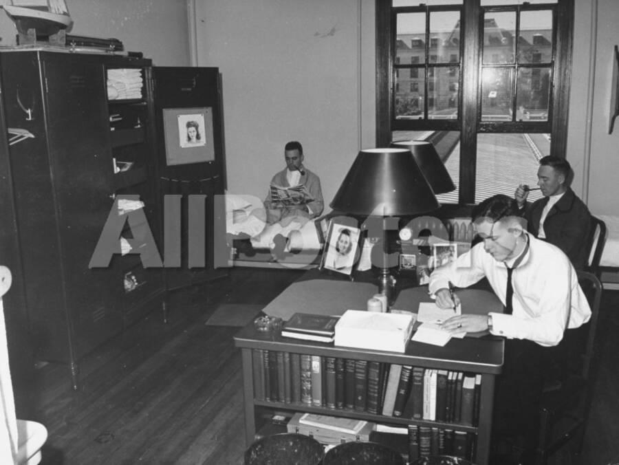 A View Of Cadets At The Annapolis Naval Academy Studying In Their Dorm Room