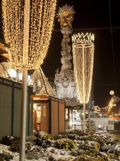 snow covered flowers christmas decorations and baroque trinity column at christmas market austria - Christmas Column Decorations snow covered flowers christmas decorations and baroque trinity column at christmas market austria - Christmas Column Decorations