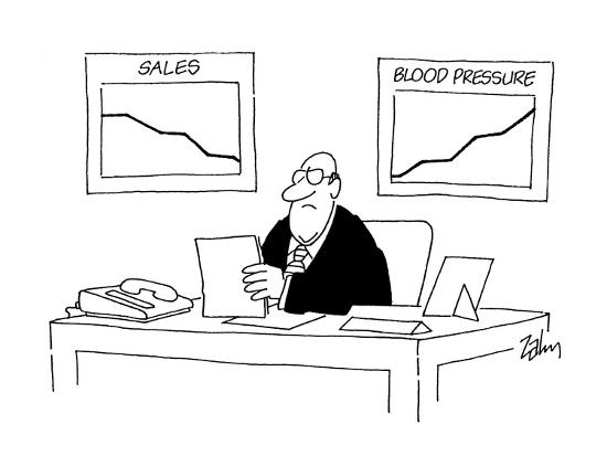 charts on wall behind gruff executive s desk sales going down
