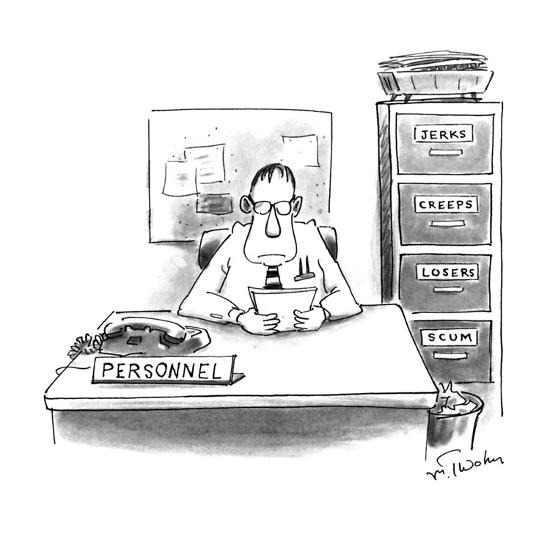 Man Sitting At Personnel Desk Next To A File Cabinet With Separate