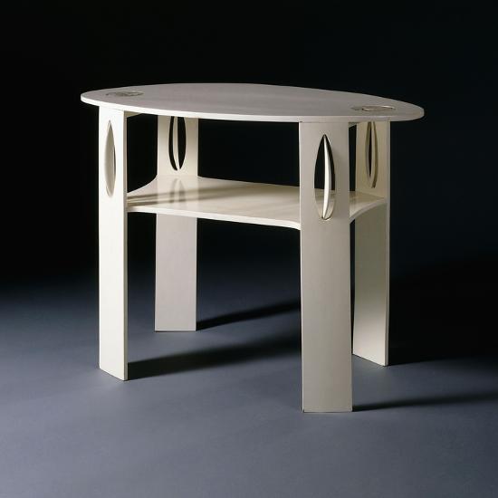 A White Oval Side Table Originally Designed For 14 Kingsborough
