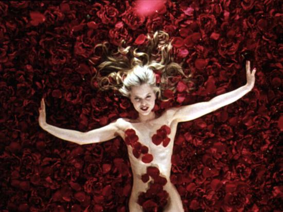 'Woman Sprawled Out on Bed of Roses Covering Her Body ...