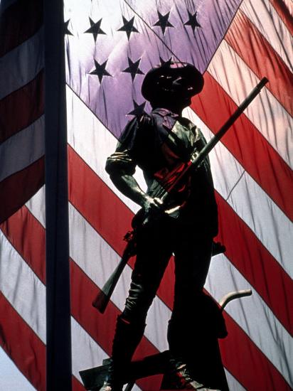US Flag with Silhouetted Statue of Soldier Photographic Print by