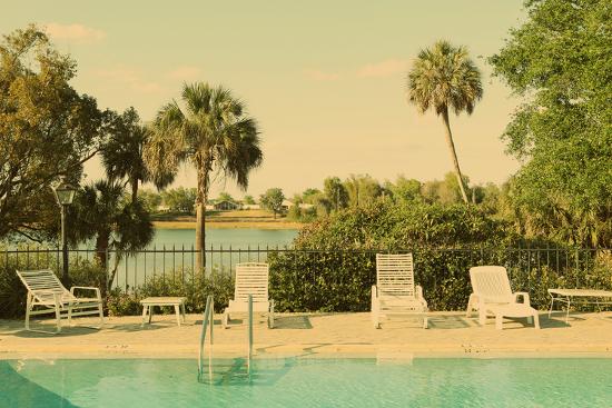 Retro Summer Swimming Pool With Empty Lounge Chairs
