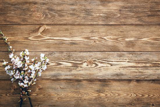 'Flowers on Wood Texture Background' Photographic Print - primopiano