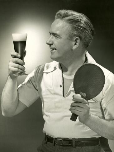 Man With Glass Of Beer And Ping Pong Paddle