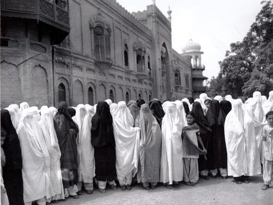 Pathan Women Observe Strict Muslim Purdah  as They Come out 