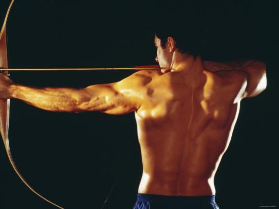 Strong Muscular Man Pulling Back on Bow and Arrow' Photographic ...