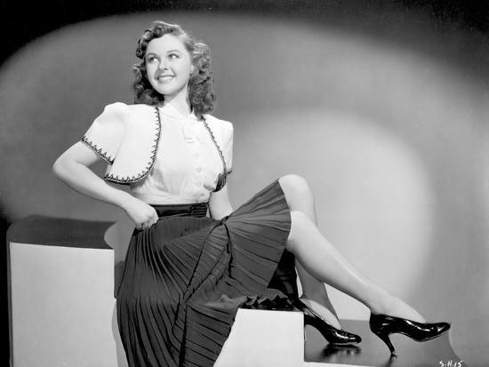 'Susan Hayward sitting in Black Skirt and Shoes' Photo - Movie Star ...