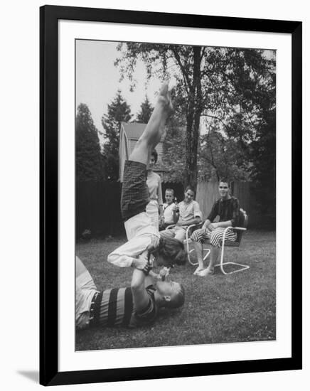 Berta de Fazio Eating Ice Cream from Reb Moore's Mouth in a Handstand-Joe Scherschel-Framed Photographic Print