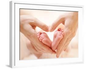 Baby Feet in Mother Hands. Tiny Newborn Baby's Feet on Female Heart Shaped Hands Closeup. Mom and H-Subbotina Anna-Framed Photographic Print